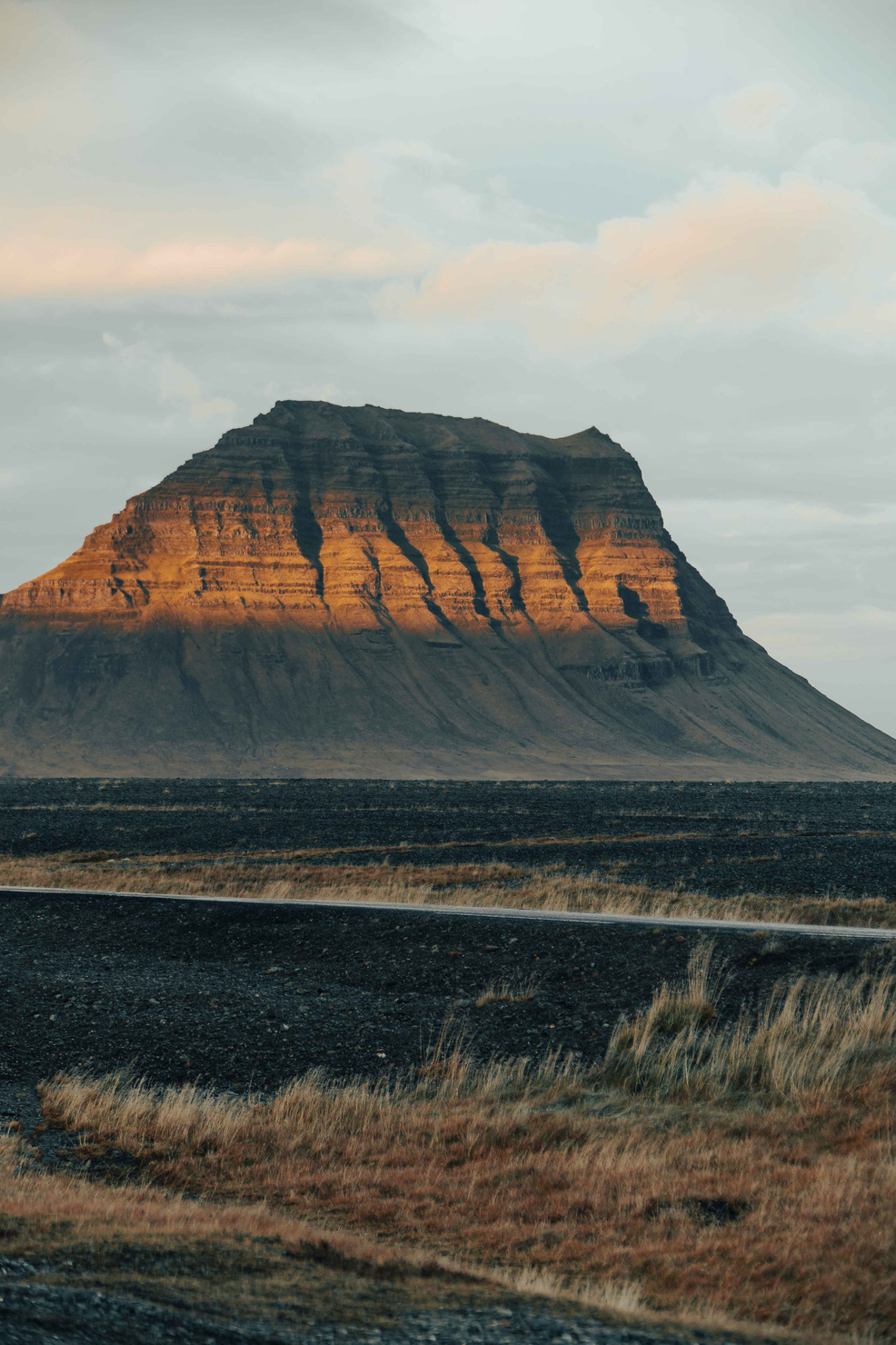 Kirkjufell: A magnificent side profile of the iconic mountain, revealing its captivating form and grandeur.