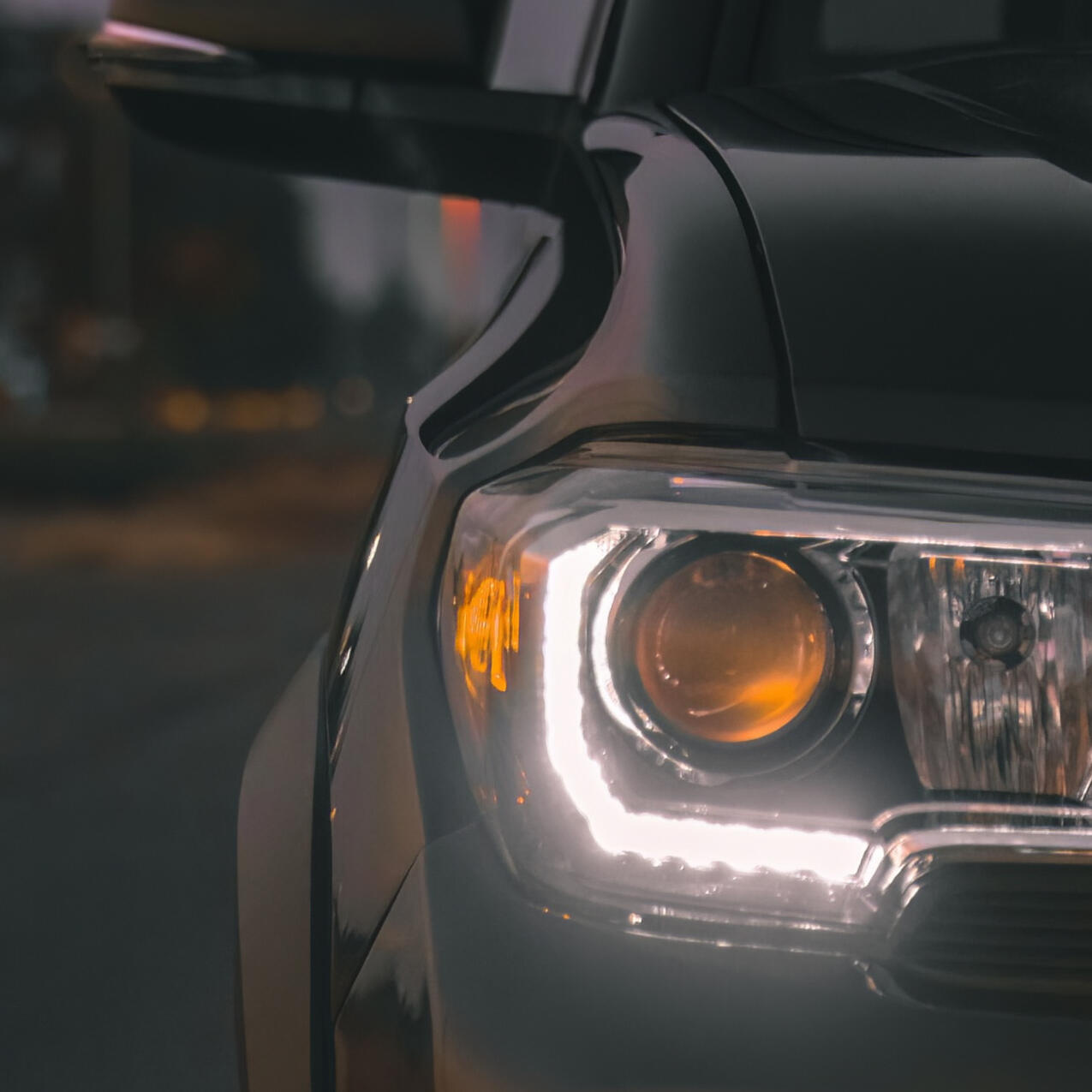 A detail shot of the right headlight of a 2022 Toyota Tacoma