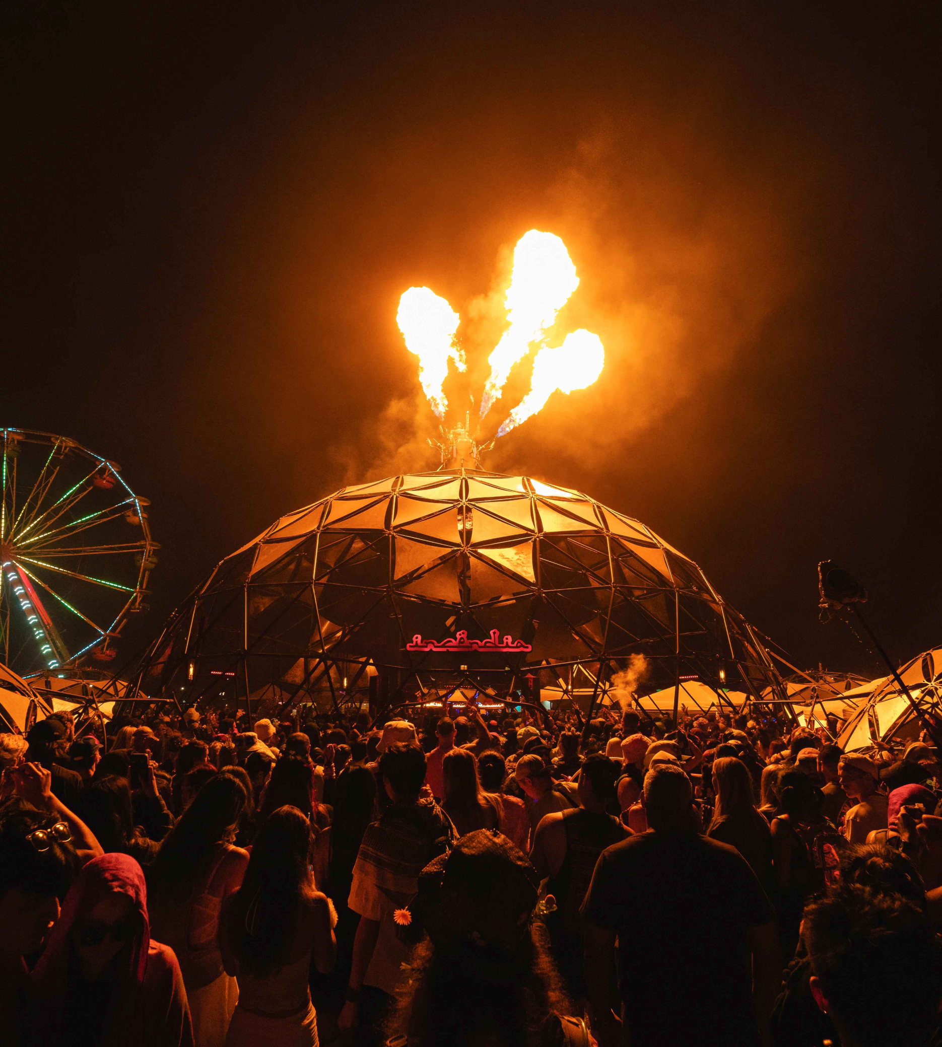 The Firepit stage at North Coast Music Festival near Chicago, with giant flames shooting into the air during a live performance.